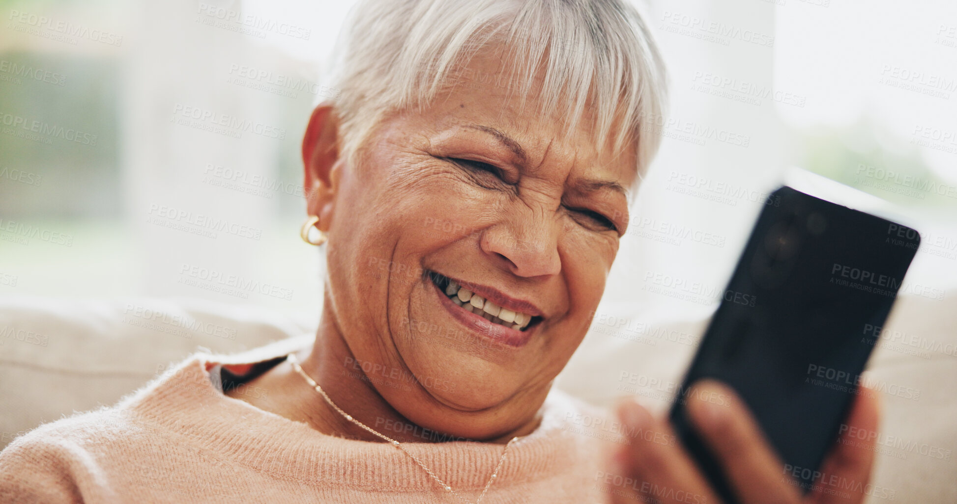 Buy stock photo Home, senior woman and cellphone with typing, funny and message for contact, texting and joke. Happy mature person, apartment and elderly lady with smartphone, laughing and mobile user with network