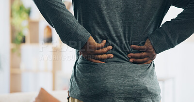 Buy stock photo Black person, back and injury with pain for bad posture, muscle tension or herniated disc at home. Closeup, hands and pressure with sore spine, cramp or ache for fibromyalgia or discomfort at house