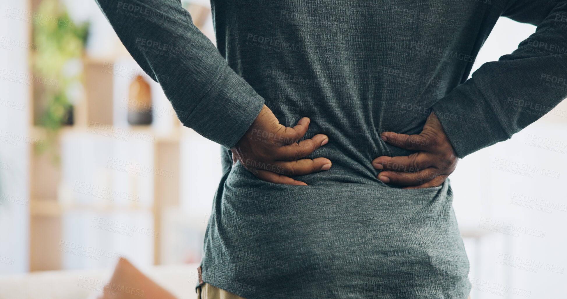 Buy stock photo Black person, back and injury with pain for bad posture, muscle tension or herniated disc at home. Closeup, hands and pressure with sore spine, cramp or ache for fibromyalgia or discomfort at house