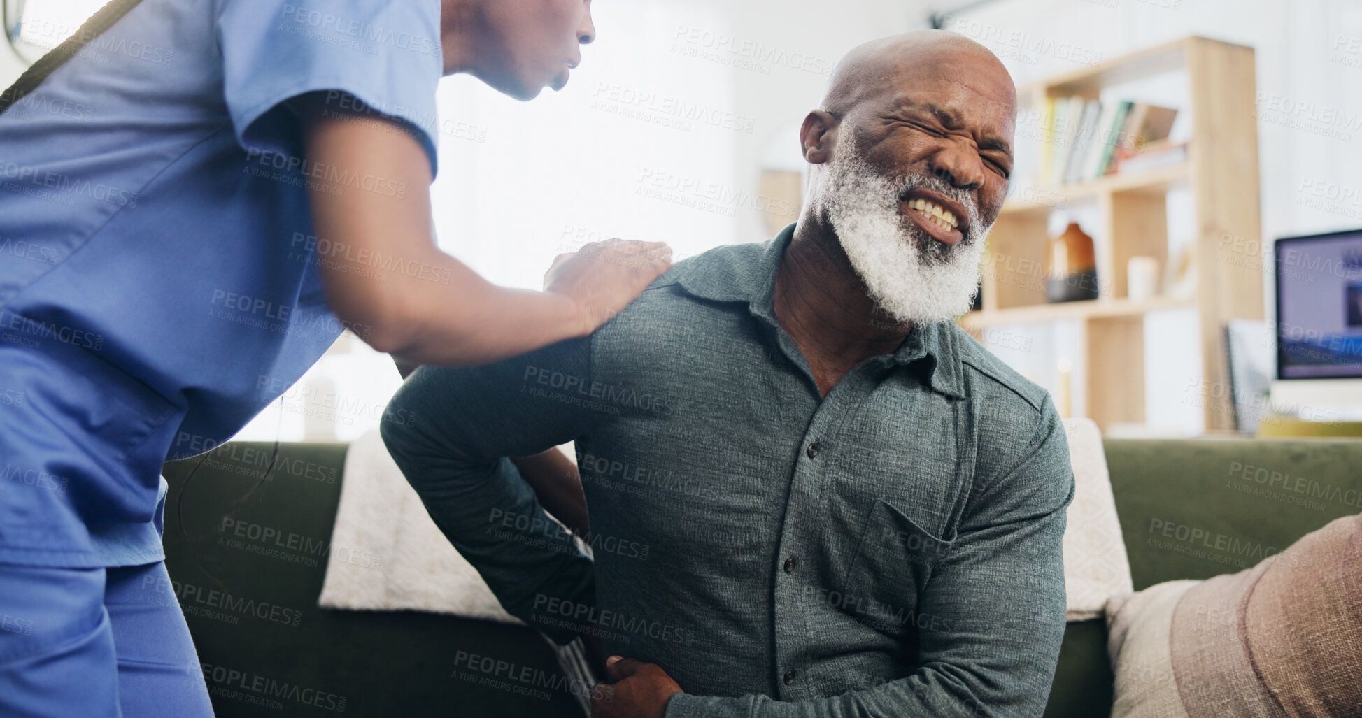 Buy stock photo Nurse, senior man and back pain in home with help, care or support for recovery from injury in retirement. Black people, physical therapy and elderly person with disability, muscle and rehabilitation