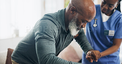 Buy stock photo Nurse, senior man and helping hand for walking in home with injury, care and support for recovery in retirement. Black people, balance and elderly person with disability, caregiver and rehabilitation