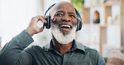 Buy stock photo Senior man, headphones and retirement for music, relax and positive mood on weekend with radio in house. Black person, listening and happy in living room for podcast, streaming or jazz with happiness