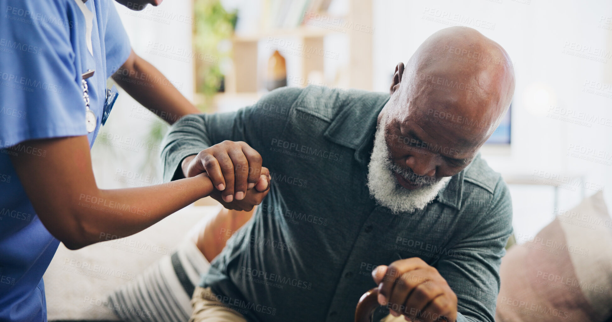 Buy stock photo Nurse, senior man and holding hands for walking by sofa, care and support for recovery from injury in retirement. Black people, cane and elderly person with disability, caregiver and rehabilitation