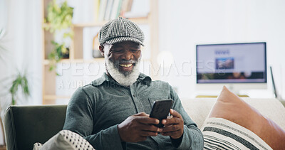 Buy stock photo Home, relax and senior man with smartphone, typing and social media with internet, connection and smile. Good news, pensioner and mature person on sofa, cellphone and mobile user with contact or text