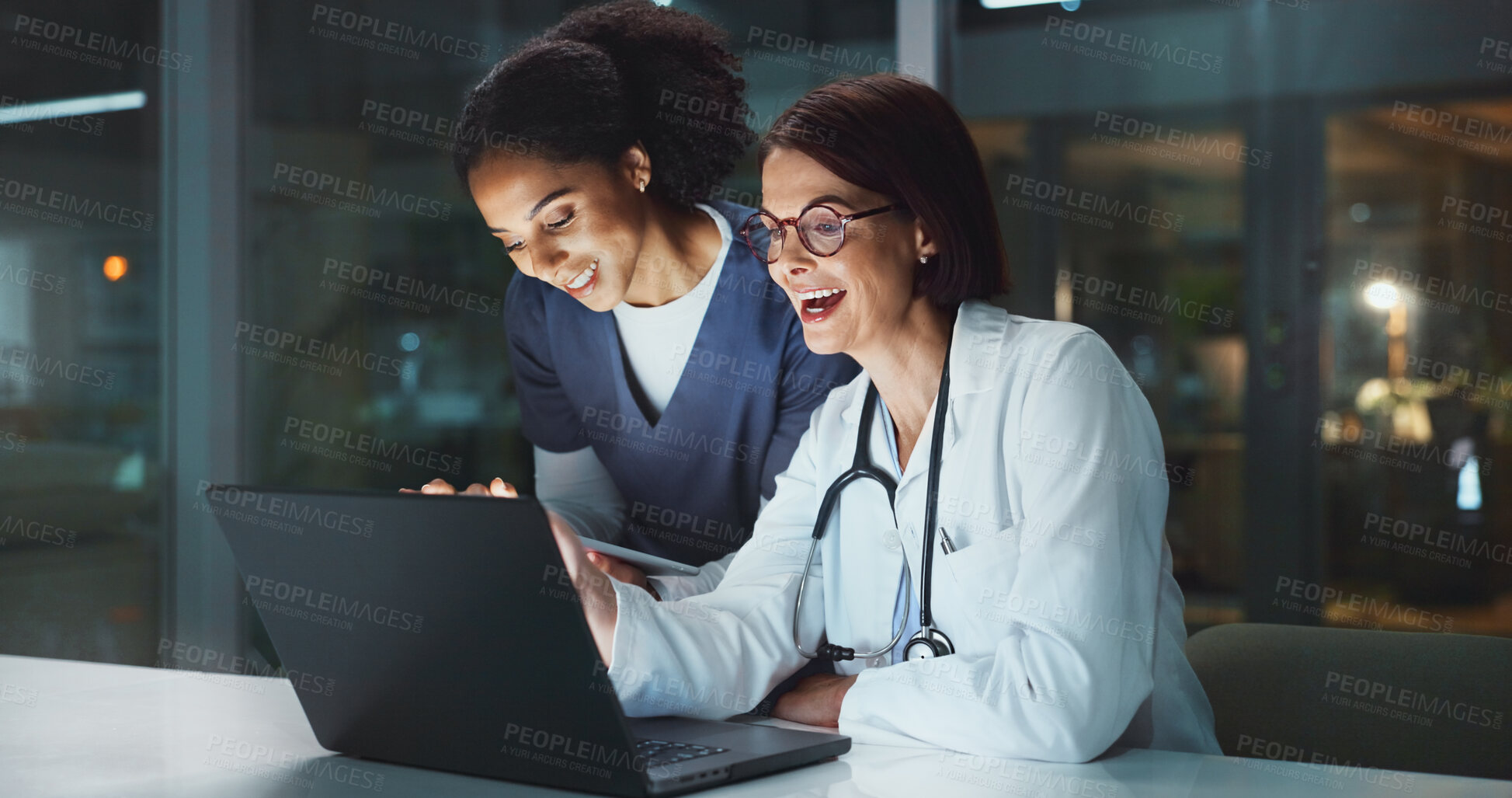 Buy stock photo Night, laughing or doctor with surgeon on laptop reading online for news update or late schedule in hospital. Medical results, smile or happy women with technology, clinic website or telehealth app