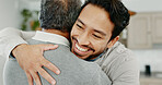 Adult son, hug and father in house, love or comfort with happiness, care or bonding together in lounge. Senior parent, dad or embrace with compassion, support or security with weekend break or smile