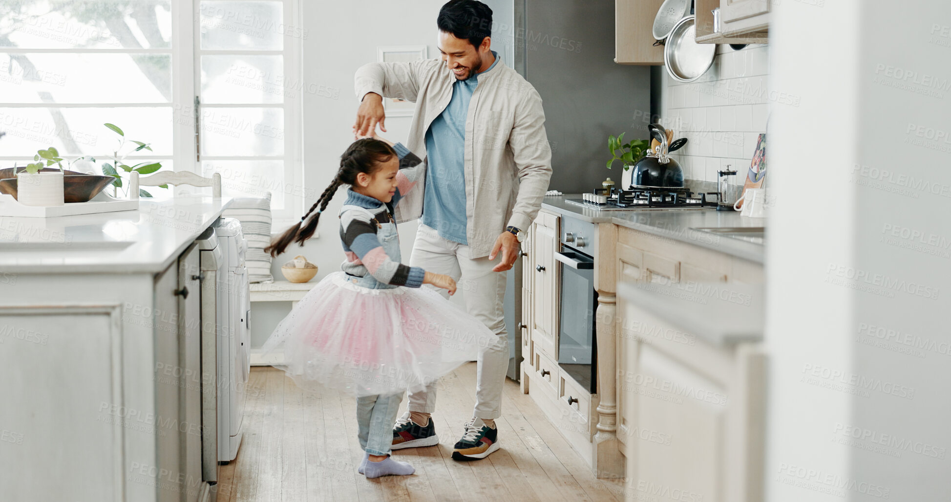 Buy stock photo Father, child and dance for ballet in kitchen with tutu, family bonding and creative artist of movement performance. Happy, man and girl for princess game with love, spin support and talent at house