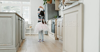 Buy stock photo Children, dance and tutu with girl in kitchen of home for morning fantasy or playful activity. Back, ballet and music with kid moving in apartment for development, energy or fun hobby on weekend