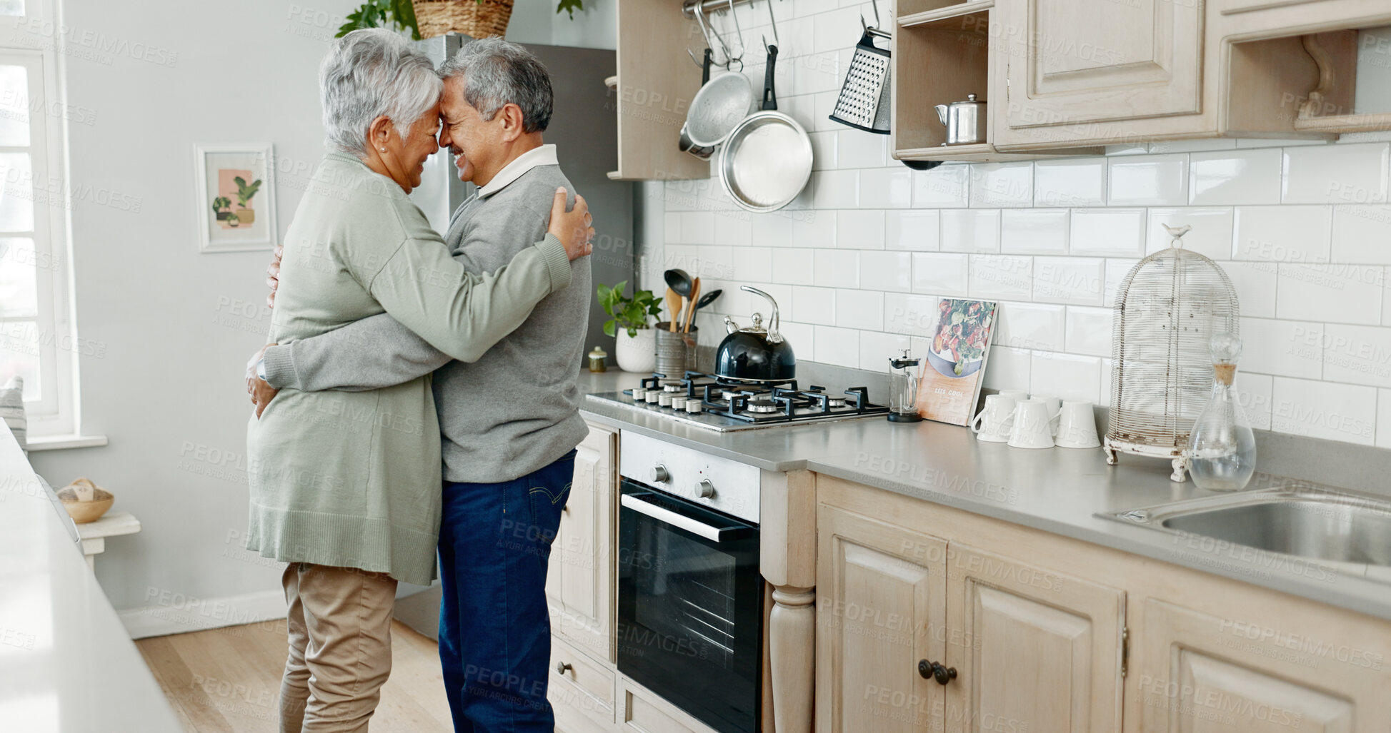 Buy stock photo Kitchen, hug and dancing with senior couple, love and bonding together with happiness, care and smile. House, mature man and old woman with embrace, movement and retirement with break and cheerful