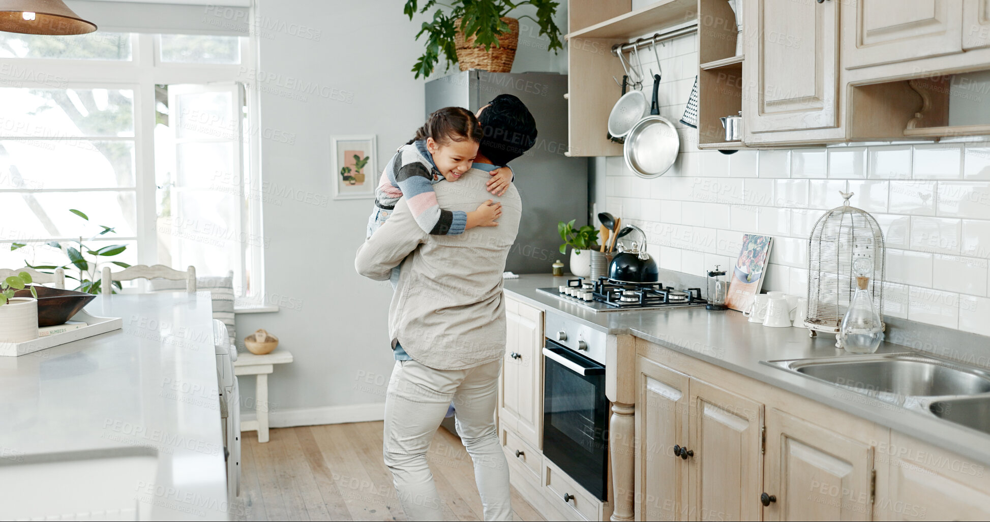 Buy stock photo Father, happy child and hug in kitchen for love, support and connection in family home. Dad, girl and embrace kid for trust, bonding or care for foster daughter with parent to celebrate custody win