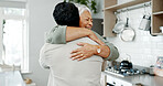 Senior woman, happy and hug in kitchen for bonding, relationship and support with overwhelmed joy. Elderly person, smile and embrace in house for reunion, welcome and love with care, omg and excited