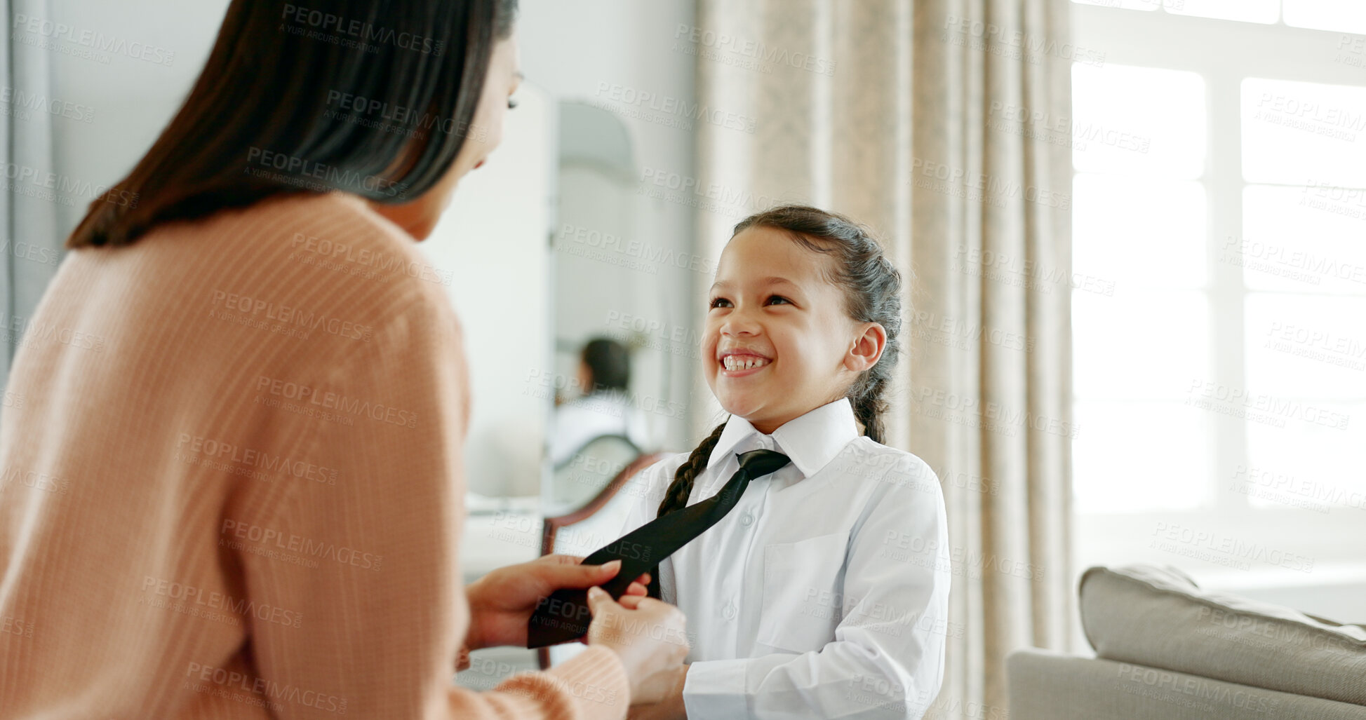 Buy stock photo Tie, school uniform and mother with girl, house and happiness with help, bonding together and care. Apartment, family and single parent with daughter, mama and kid with shoes, excited and morning