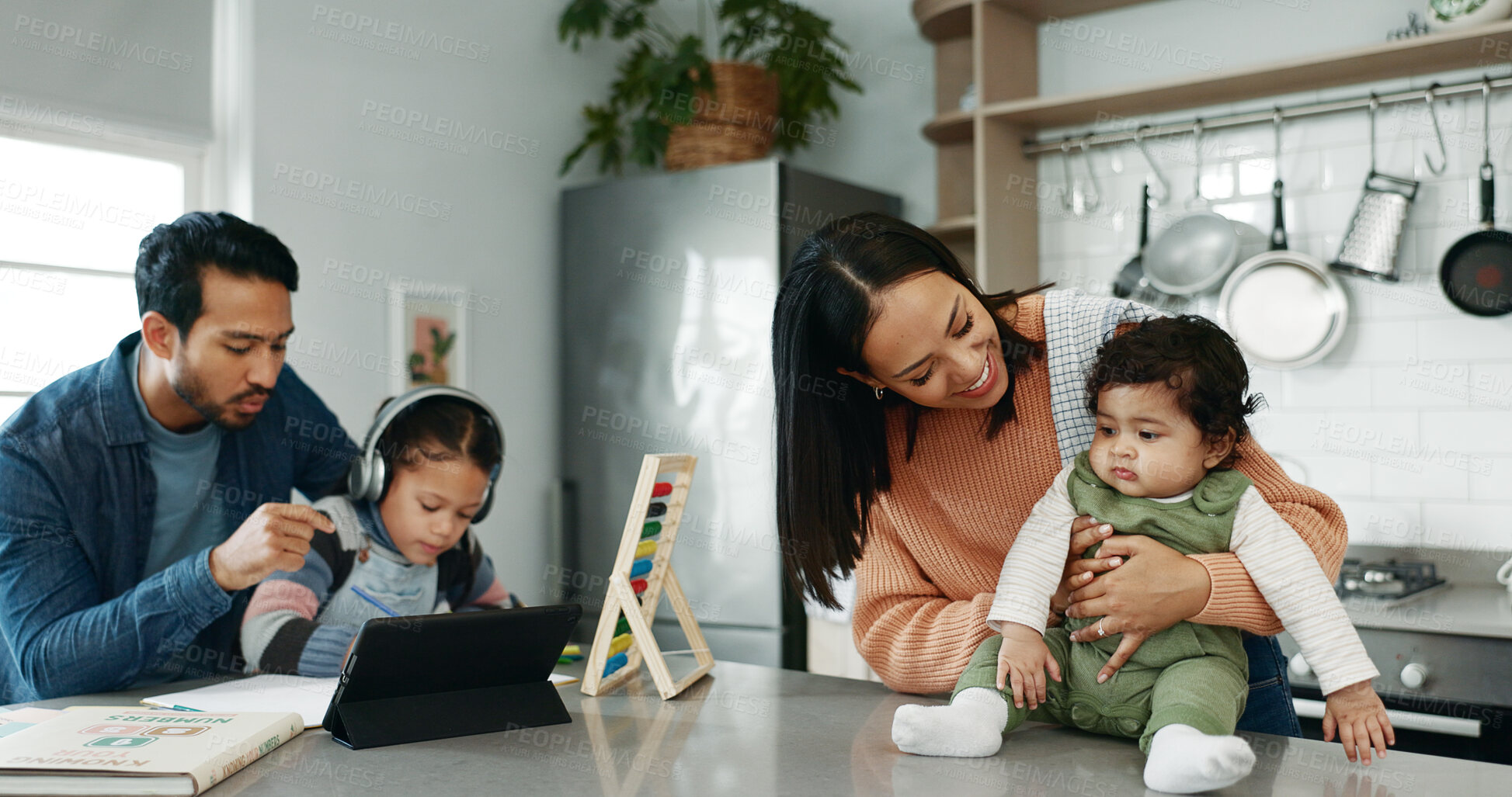 Buy stock photo Parents, children and homework with baby in kitchen for bonding, care and love with support in family house. Father, mother and daughter with infant, happy and tablet for online course at apartment