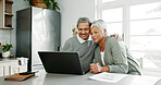 Senior, happy couple and hug with documents on laptop for retirement, finance or pension fund in kitchen at home. Elderly man, woman or lovers with smile on computer for embrace or financial planning