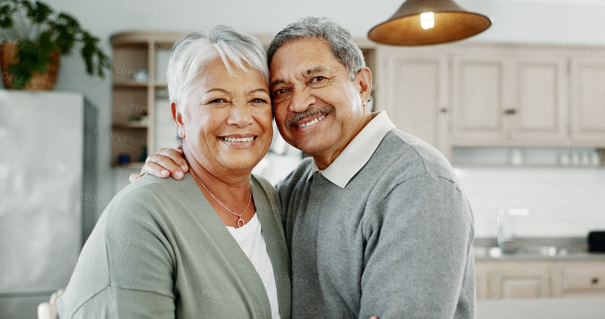 Buy stock photo Kitchen, senior couple and portrait with hug for love, connection and bonding together in retirement. Elderly people, woman and man with embrace in marriage, commitment and security with care at home