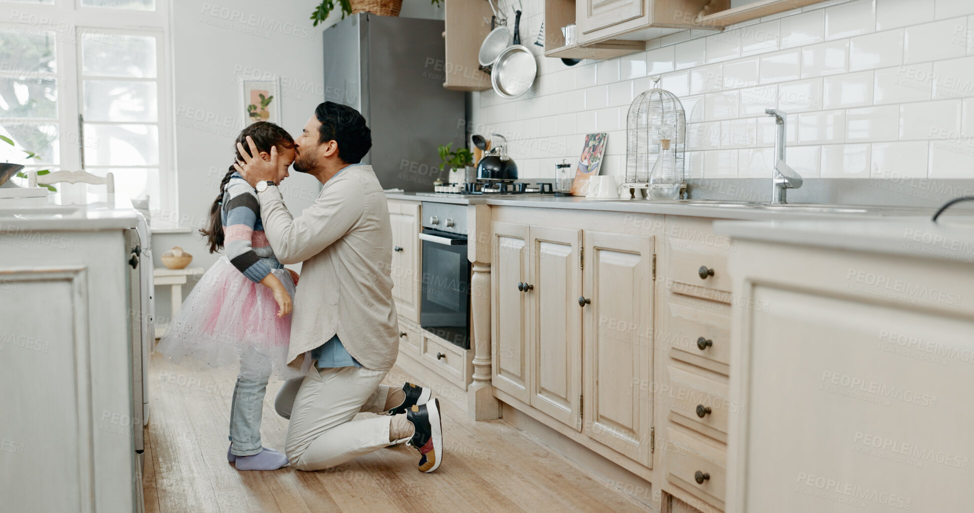 Buy stock photo Home, child and father with kiss on forehead, support and motivation for ballet dancer with tutu. Kitchen, dad and girl with embrace for bonding, creative costume and artistic expression with love