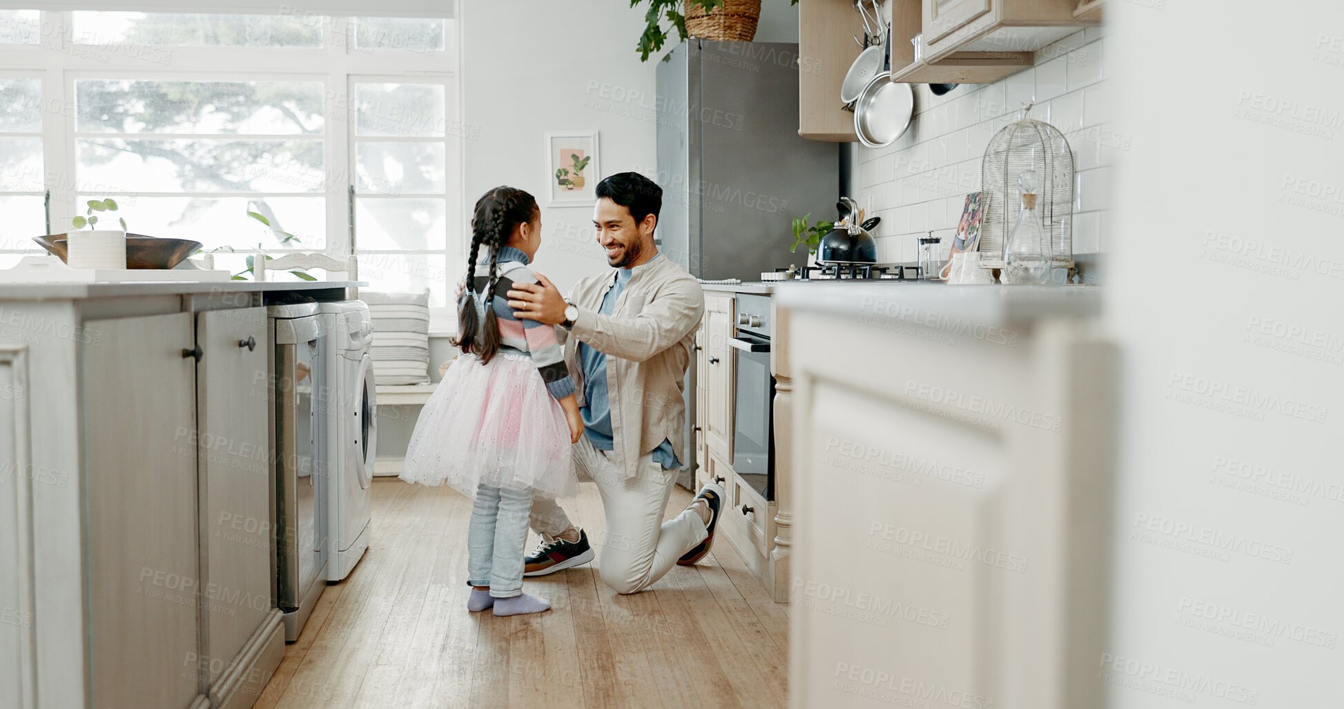 Buy stock photo Girl, ballerina and dancing with father in home, kitchen or support with smile, care and bonding. Man, dad and child with ballet, connection and tutu for funny games with conversation in family house