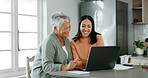 Home, mother and daughter with laptop for budget, track expenses and success for financial goals. Kitchen, senior mom and happy woman with tax review for retirement, insurance savings and mortgage