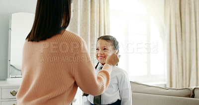 Buy stock photo Mom, girl and dressing for school, help and support with tie, clothes and preparation in living room. Woman, child and teaching daughter for love, care and development in house with campus uniform