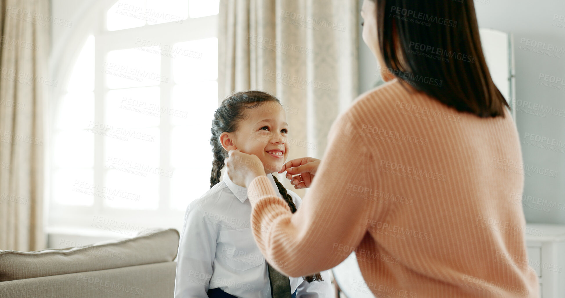 Buy stock photo School, dressing and mom with child in home getting ready for education, learning and classes. Family, morning routine and happy mother with girl prepare with tie, uniform and clothes for academy