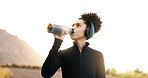 Woman, drinking water or music in nature for fitness, hydration or electrolytes for energy. Girl, podcast or liquid in bottle for refreshment, healthy body or rest from running on mountain in Brazil