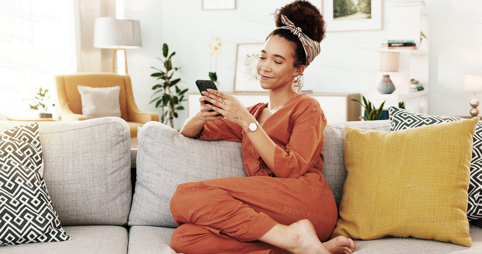 Buy stock photo Smartphone, smile and woman in home, sofa and chilling in living room, app and relax in apartment. Lounge, peace and happy in weekend, mobile and comfortable on couch, game and playing with internet