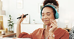 Happy woman, headphones and dancing with phone for music, listening or podcast on sofa at home. Young, female person or dancer enjoying audio streaming, sound or tune with headset or smile at house
