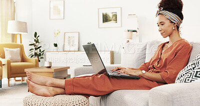 Buy stock photo African woman, laptop and relax on sofa for movie, communication and social media with writing blog. Female person, technology and happy on couch for film, app subscription and reading news in house