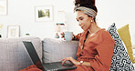 Happy woman, coffee and relax with laptop on sofa for online browsing, research or app at home. Young, female person or vlogger with caffeine or computer on couch for reading or scrolling at house