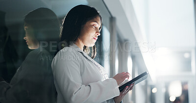 Buy stock photo Woman, doctor and tablet in night, reading and thinking with report, results and wellness at hospital. Person, medic and app with digital touchscreen for review, feedback or research for healthcare