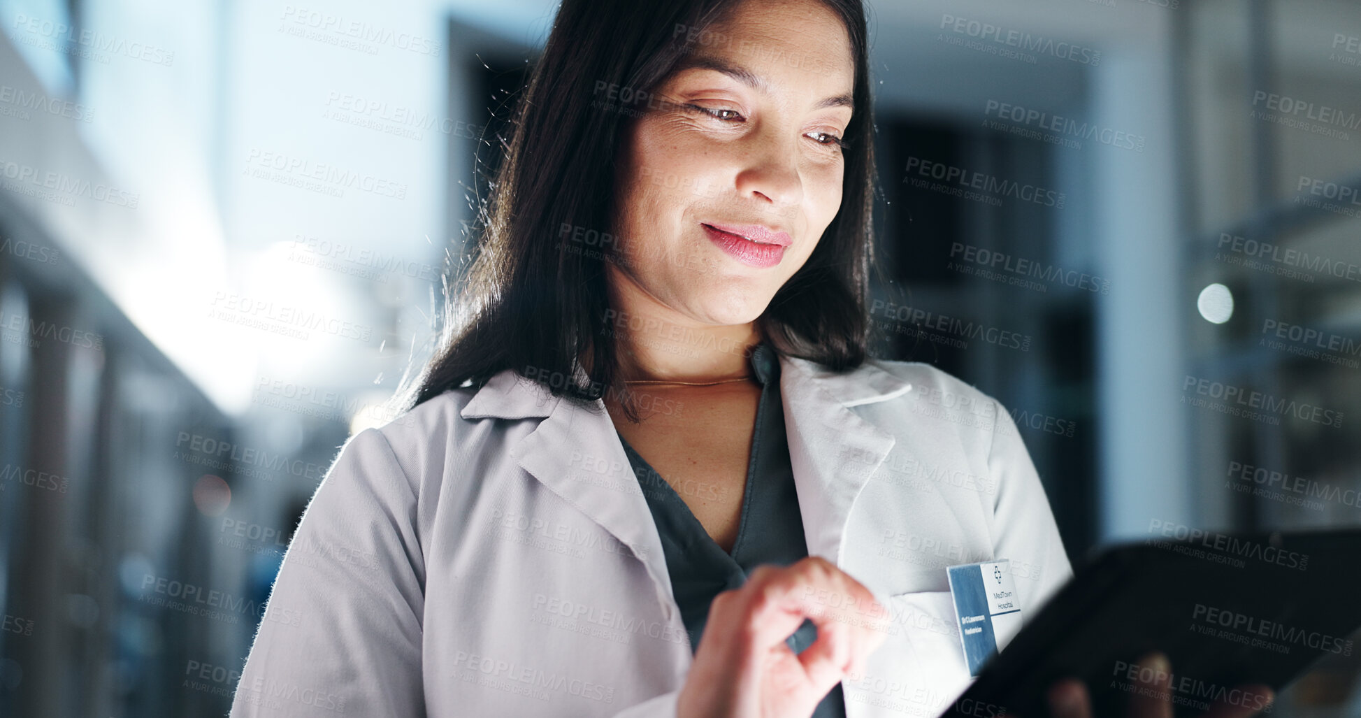 Buy stock photo Woman, doctor and tablet in night, smile and reading with report, results and thinking at hospital. Person, medic and happy with digital touchscreen for review, feedback or research for healthcare