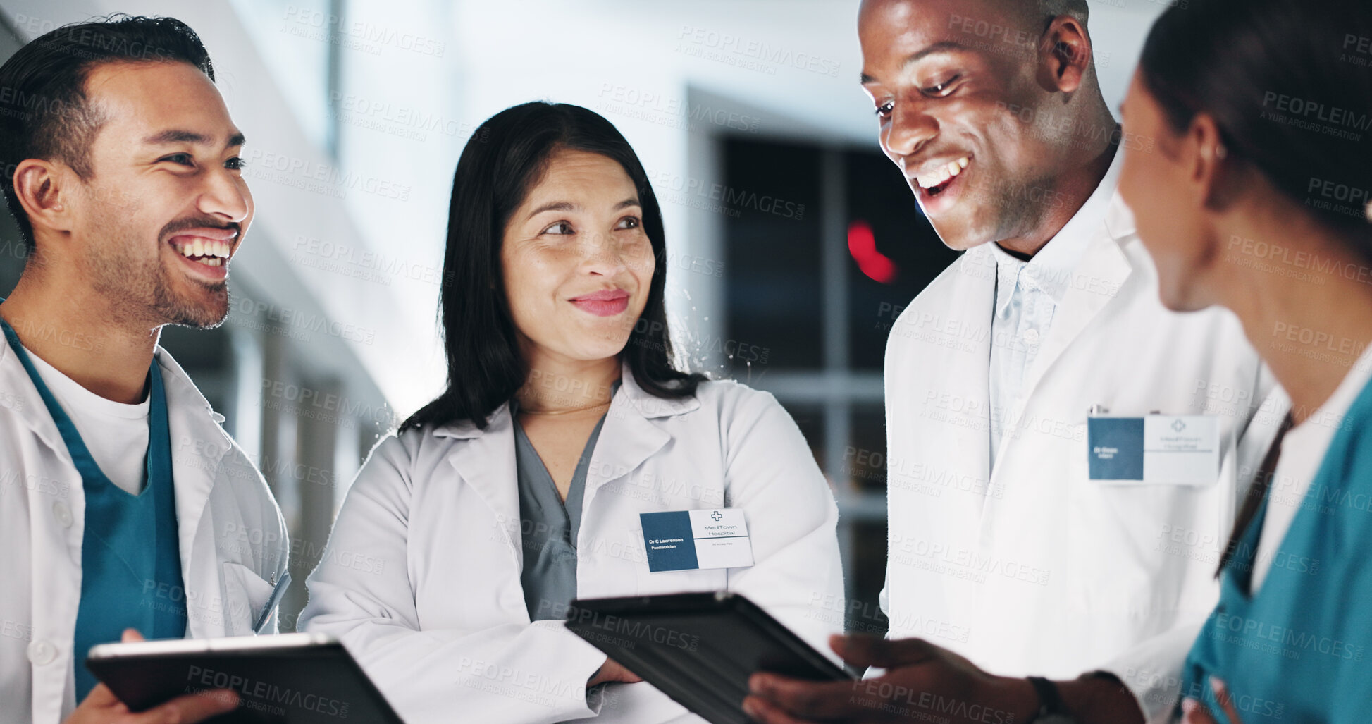 Buy stock photo Group, doctors and tablet at clinic, happy and circle with report, results or strategy at night. People, teamwork and diversity with digital touchscreen for review, feedback and research at hospital