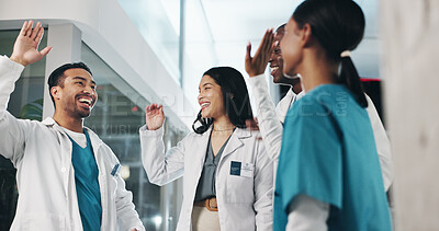 Buy stock photo Healthcare, team and celebration in hospital for success, medical breakthrough and excited for achievement. Doctors, nurses and high five in lobby for job excellence, collaboration and announcement