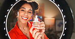 Happy woman, portrait or influencer with ring light for skincare, makeup or online beauty tutorial at home. Young, female person or vlogger in POV with cosmetic product, serum or oil for glowing skin