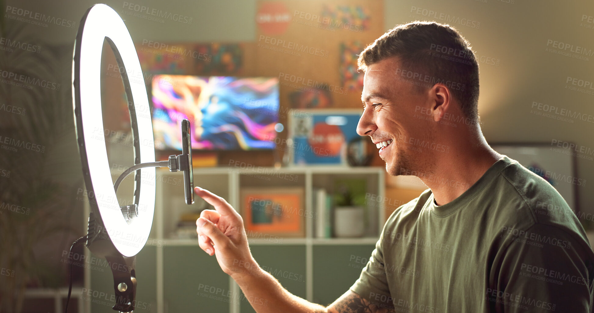 Buy stock photo Influencer, ring light and smile at phone for streaming, follower interaction and content creation. Man, gamer and mobile in home for subscriber engagement, introduction and connectivity in profile