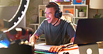 Influencer, happy and headphones at tech for streaming, follower interaction and content creation. Man, gamer and ring light in home for subscriber engagement, esports and excited in living room