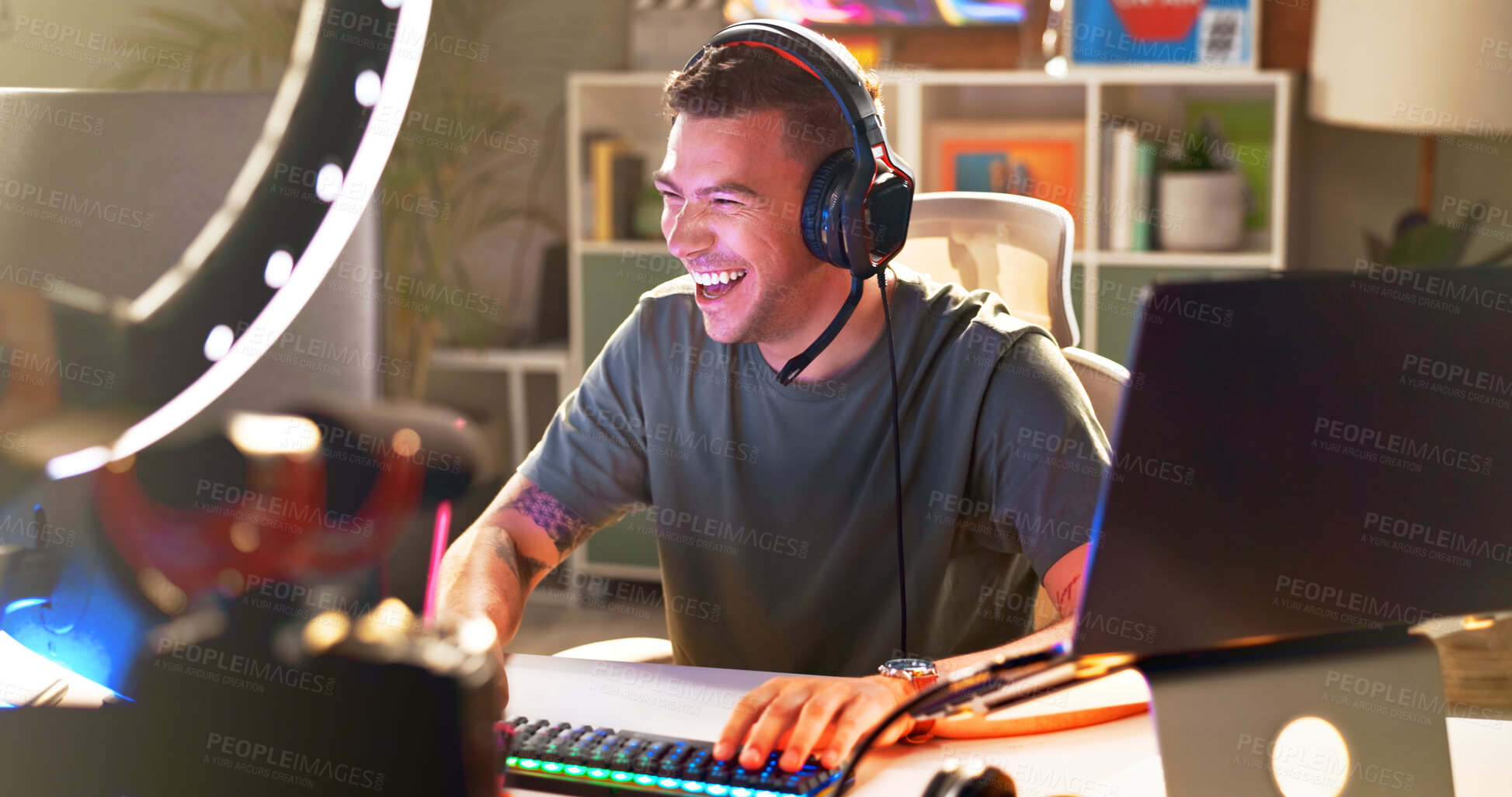 Buy stock photo Influencer, happy and headphones at tech for streaming, follower interaction and content creation. Man, gamer and ring light in home for subscriber engagement, esports and excited in living room