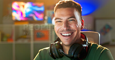 Buy stock photo Happy man, portrait and gamer with headphones for esport, online tournament or streaming at home. Young, male person or streamer with smile or headset at night for console or computer gaming at house