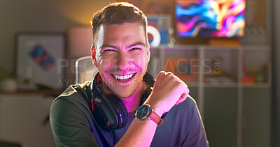 Buy stock photo Happy man, portrait and gamer with headphones at night for esport, online tournament or streaming at home. Young, male person or streamer with smile or headset for console or computer gaming at house