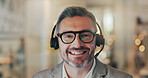 Customer service, call center and portrait of happy man for telemarketing, communication and help. Office, night and face of person with headset for contact, crm support and consulting in Netherlands