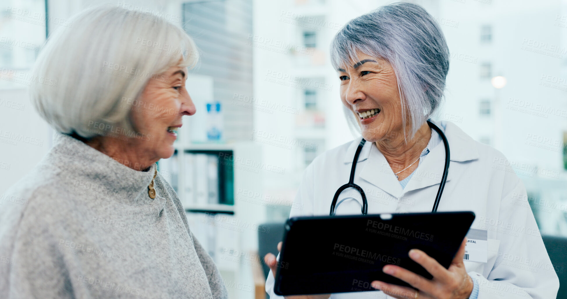 Buy stock photo Happy women, doctor and tablet with patient for healthcare results, exam or test at hospital. Senior female person, medical employee or surgeon with technology for elderly care or clinic consultation