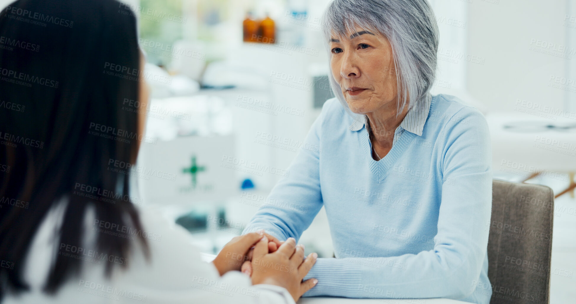 Buy stock photo Elderly woman, holding hands or empathy in hospital for help, support or hope in consultation. Doctor, senior person or healthcare at table for grief counselling, trust or mental health in retirement