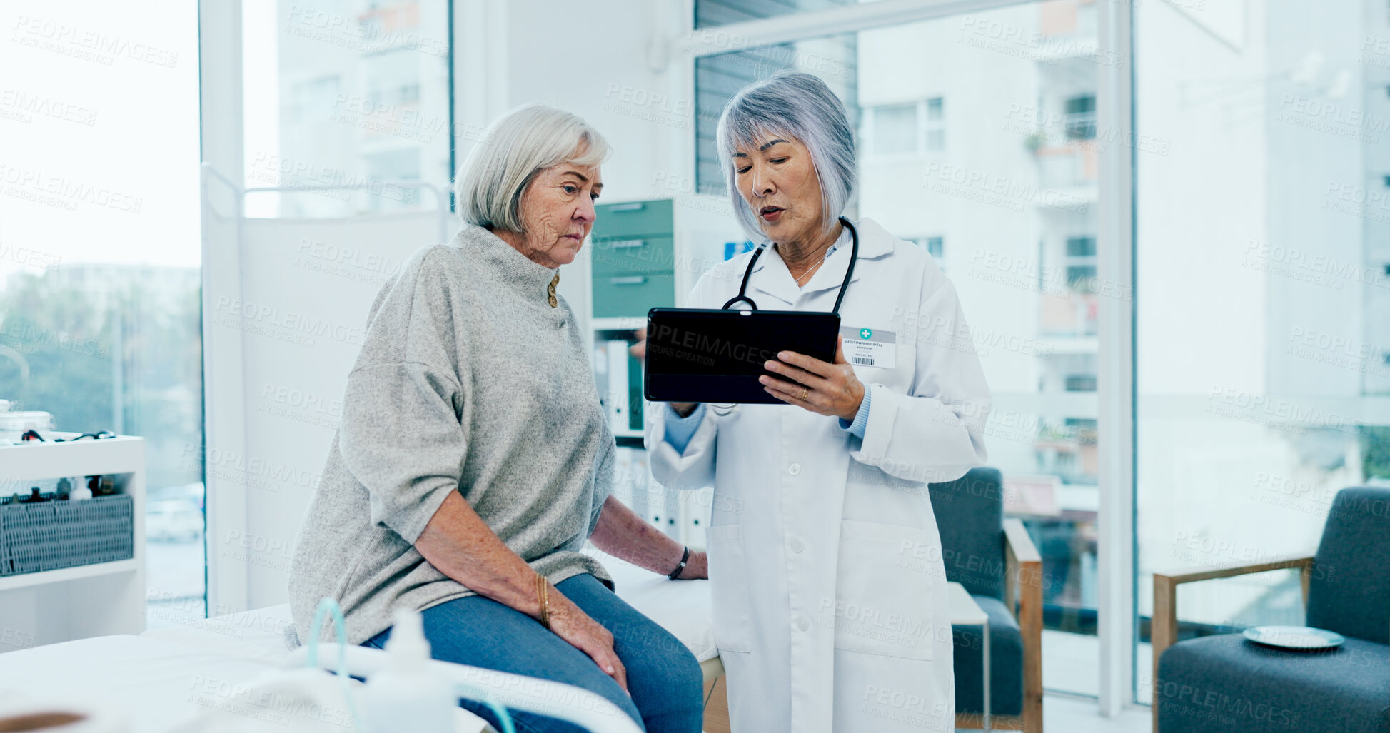 Buy stock photo Mature women, patient and doctor with tablet for checkup for medical results, prescription or diagnosis at clinic. Senior, female person or healthcare employee with technology for health exam or test