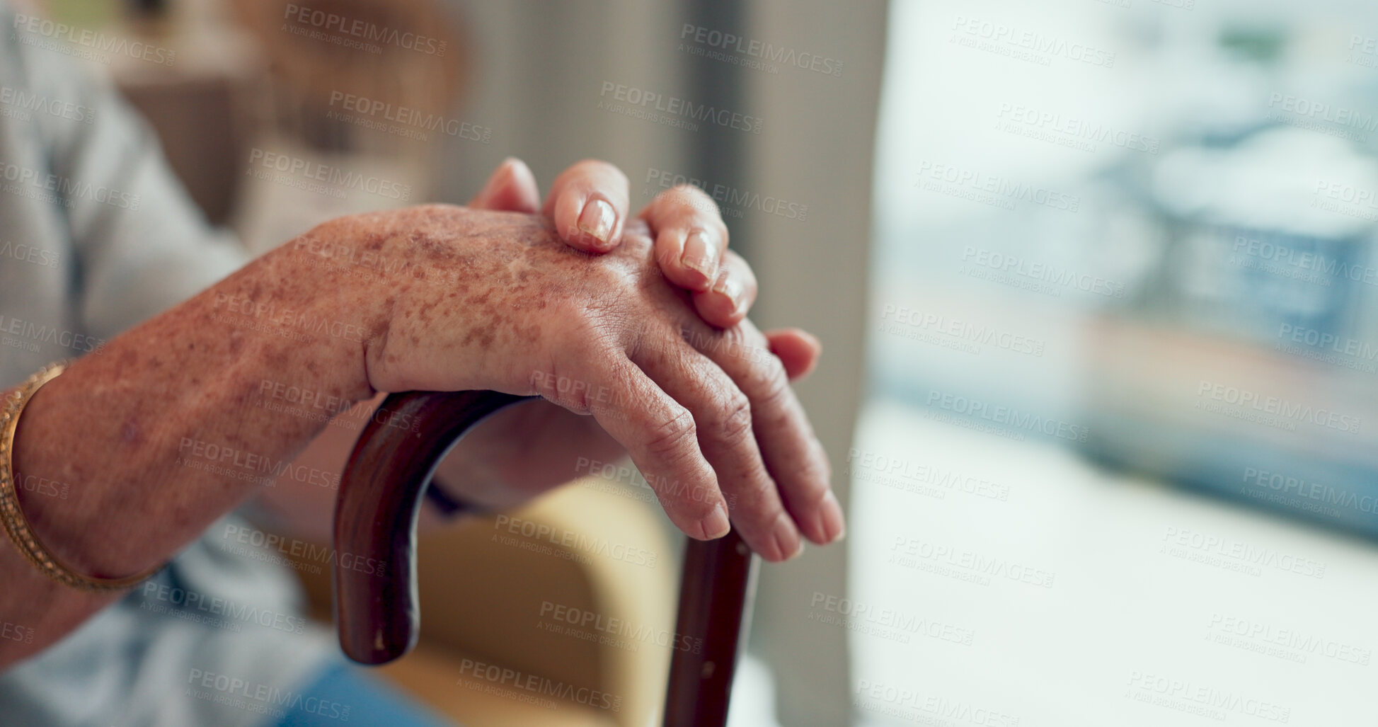 Buy stock photo Hands, walking stick and couch in home for senior person with disability, mobility and recovery from stroke. Elderly care, cane and support for steps, balance and relax on living room sofa in house