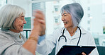 Mature woman, doctor and high five with tablet for good news, healthcare results or wellness at hospital. Female person, medical employee or surgeon with technology for elderly care or consultation