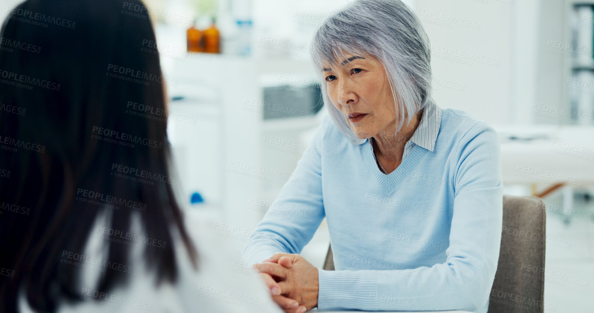 Buy stock photo Holding hands, doctor and senior patient on consultation for support with results, feedback and report on diagnosis. People, healthcare and sad for advice, help and discuss with kindness at clinic