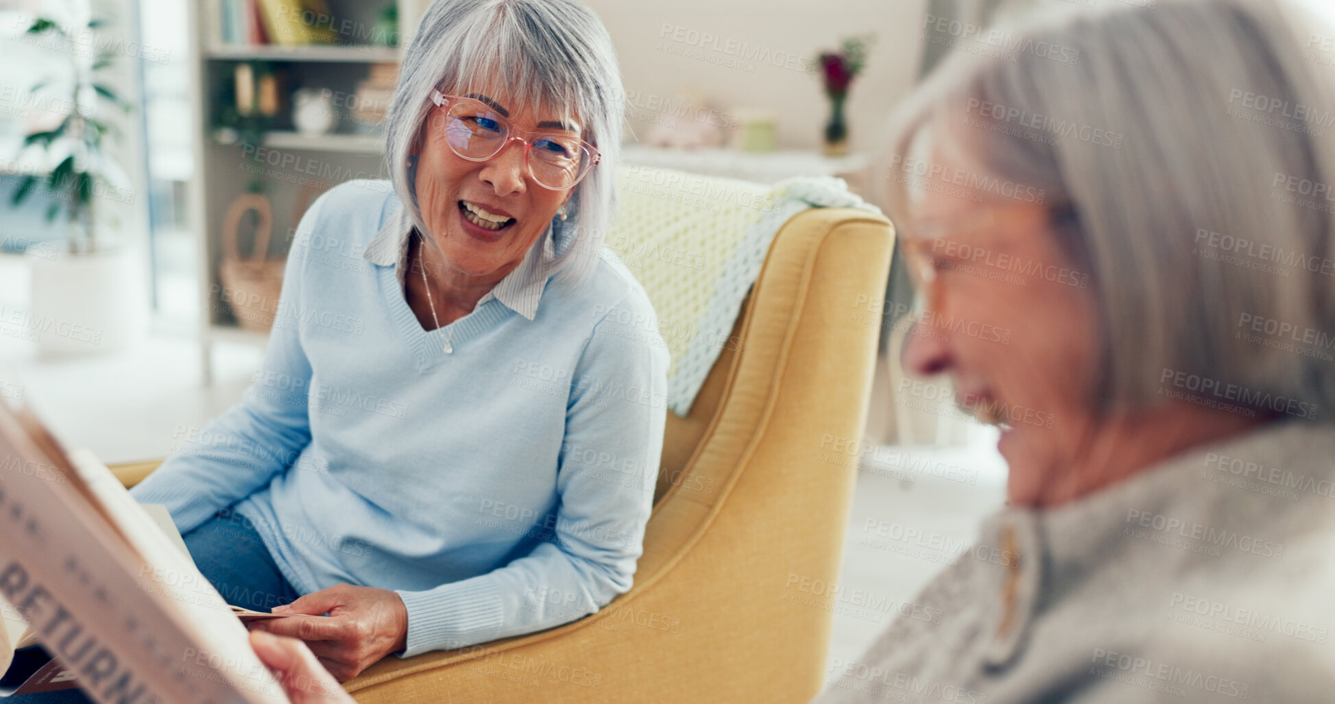 Buy stock photo Senior women, friends and happy with newspaper at nursing home for news, gossip and entertainment. People, pensioner and smile or laughing on sofa on retirement with conversation, fun and break