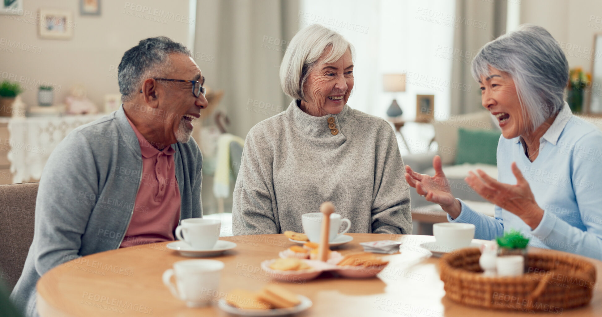 Buy stock photo Laugh, tea and senior friends at table for funny conversation, snacks and retirement together in house. Group, party and man speaking with elderly women smile for breakfast, communication and bonding