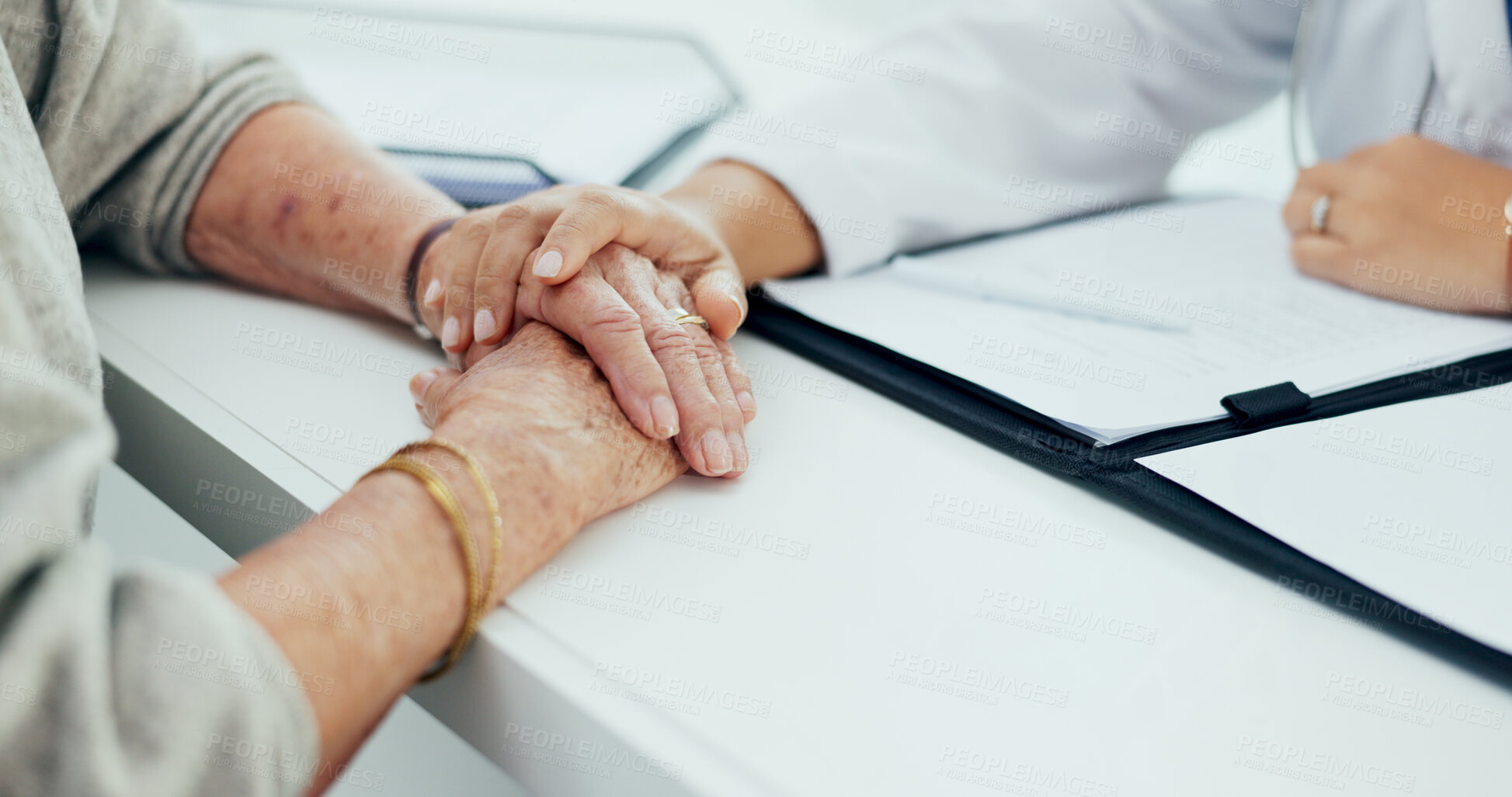 Buy stock photo Doctor, elderly care or holding hands with patient for empathy, understanding or support at hospital. Closeup, medical caregiver or nurse with touch for grief, sympathy or trust at clinic appointment