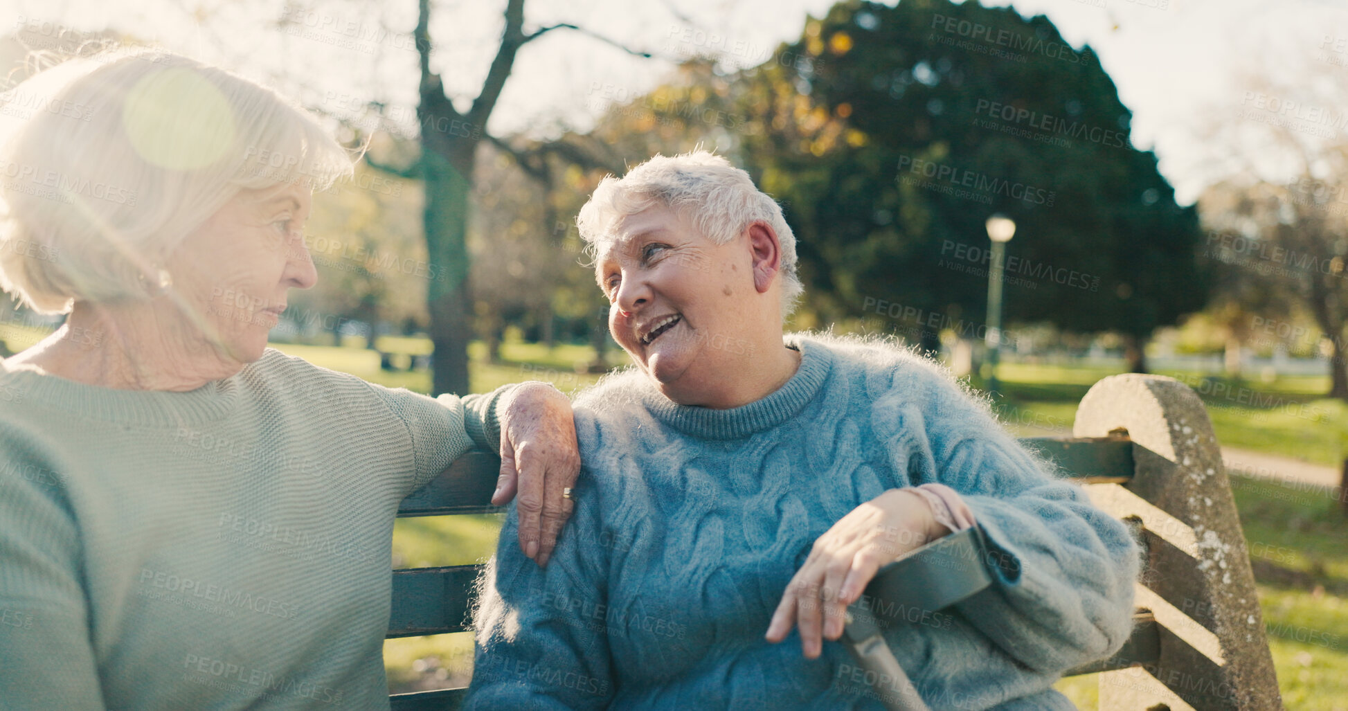 Buy stock photo Friends, happy and senior women in park for bonding, conversation and relax together outdoors. Morning, retirement and elderly people on bench talking, chatting and laughing in nature for fresh air